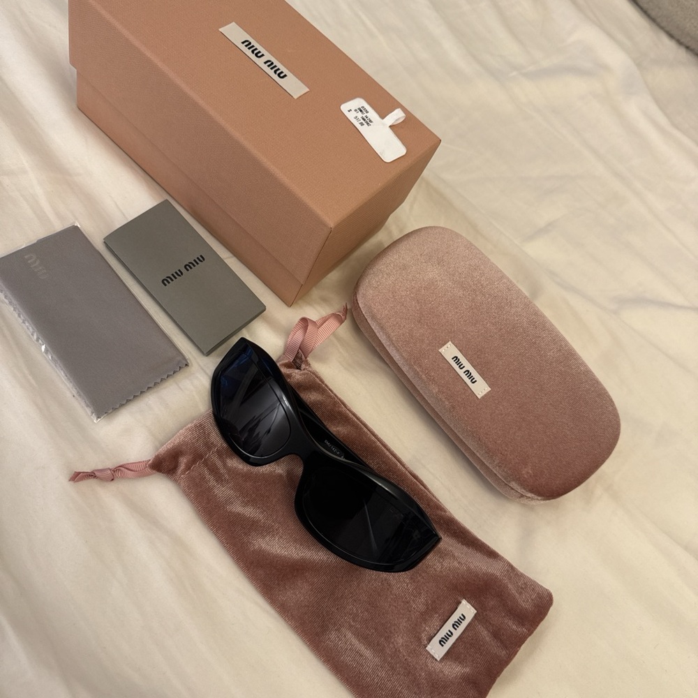 Miu Miu Black Sunglasses with Gold Details